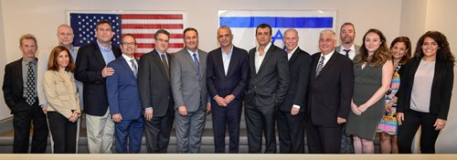 Moshe-Kahlon-and-Israel-Bonds-staff.jpg